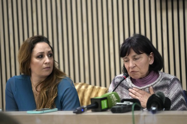 Lawyer Laura Sgro, left, listens to Gloria Branciani during a press conference in Rome, Wednesday, Feb. 21, 2024. Gloria Branciani, 59, is one of the first women who accused Rev. Marko Rupnik, a once-exalted Jesuit artist of spiritual, psychological and sexual abuse. Gloria Branciani went public Wednesday to demand transparency from the Vatican and a full accounting of the hierarchs who covered Rupnik for 30 years. (APPhoto/Alessandra Tarantino)