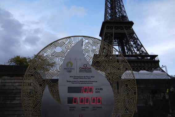 The countdown clock reading 100 days before the Paris 2024 Olympic Games opening ceremony is seen Wednesday, April 17, 2024 in Paris. The Paris 2024 Olympic Games will run from July 26 to Aug. 11. (AP Photo/Christophe Ena)