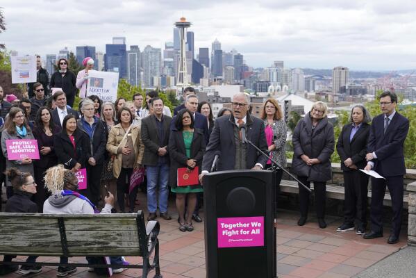 Washington Gov. Jay Inslee speaks Tuesday, May 3, 2022, at a rally at a park overlooking Seattle. Inslee said that Washington state would remain a pro-choice state and that women would continue to be able to access safe and affordable abortions. (AP Photo/Ted S. Warren)