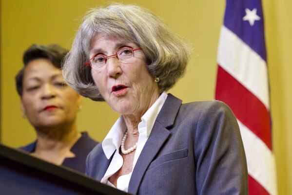 Anne Kirkpatrick speaks during a news conference at City Hall in New Orleans, Sept. 11, 2023, as Mayor LaToya Cantrell, back left, listens. Kirkpatrick was sworn in Wednesday, Nov. 1, 2023 as the first woman to hold a permanent appointment as the chief of police in New Orleans. Kirkpatrick has served as interim chief since June, when Mayor LaToyal Cantrell appointed her. (Chris Granger/The New Orleans Advocate via AP, file)