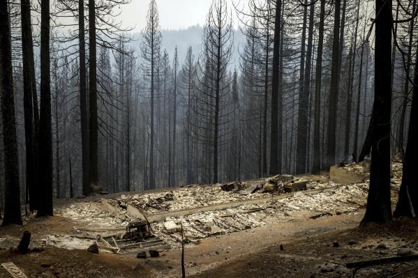 Scorched property destroyed by the Caldor Fire is seen in Grizzly Flats, Calif., on Wednesday, Aug. 18, 2021. (AP Photo/Ethan Swope)