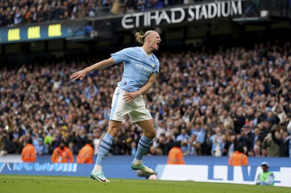 Manchester City's Erling Haaland celebrates scoring his side's second goal of the game, during the English Premier League soccer match between Machester City and Brighton & Hove Albion, at the Etihad Stadium, in Manchester, England, Saturday, Oct. 21, 2023. (Tim Goode/PA via AP)