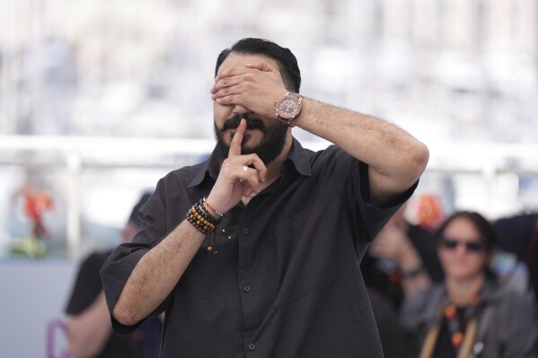 Director Morad Mostafa poses for photographers at the photo call for the film 'Aisha Can't Fly Away' at the 78th international film festival, Cannes, southern France, Wednesday, May 21, 2025. (Photo by Lewis Joly/Invision/AP)