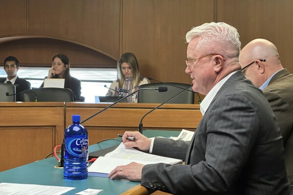 Georgia state Sen. Randy Robertson, R-Cataula, discusses a bill to punish cities and counties that break state immigration law during a meeting of the Senate Public Safety Committee, Wednesday, March 6, 2024, at the Georgia Capitol in Atlanta. The committee passed the bill, saying penalties are needed for local governments that disobey Georgia state law by passing policies to harbor undocumented immigrants. (AP Photo/Jeff Amy)