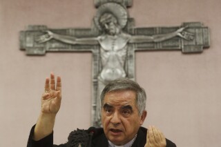FILE - Cardinal Angelo Becciu talks to journalists during press conference in Rome, on Sept. 25, 2020. The Vatican prosecutor asked a court Wednesday July 26, 2023 to convict 10 people, including Cardinal Becciu, of a range of financial crimes, sentence them between three to 13 years in prison and order the confiscation of some 415 million euros to pay the Holy See back for bad investments and financial losses over the past decade. (AP Photo/Gregorio Borgia, File)