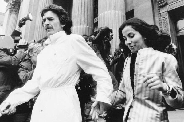FILE -Former Beatle George Harrison and his wife Olivia leave the Marylebone Register office in London after attending the wedding of former Beatle drummer Ringo Starr April 27, 1981. Harrison's widow Olivia will release a collection of 20 original poems about her husband for the book “Came the Lightening,” which comes out June 21, it was announced Thursday, April 21, 2022. (AP Photo/File