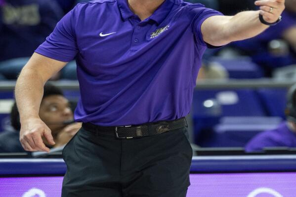 FILE - James Madison head coach Sean O'Regan directs his team during the first half of a women's NCAA college basketball game against North Carolina in Harrisonburg, Va., Sunday, Nov. 20, 2022. James Madison’s winter sports teams have picked up right where the fall programs finished in their transition to the Sun Belt Conference.(Daniel Lin/Daily News-Record via AP, File)