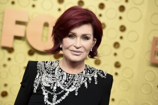 FILE - Sharon Osbourne arrives at the 71st Primetime Emmy Awards on Sept. 22, 2019, in Los Angeles. CBS says Sharon Osbourne will no longer appear on its daytime show "The Talk" after a heated on-air discussion about racism earlier this month. (Photo by Jordan Strauss/Invision/AP, File)