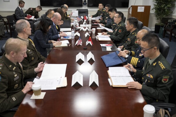 In this photo proved by the Defense Department, Deputy Assistant Secretary of Defense for China, Taiwan and Mongolia Michael Chase hosts delegates from China for the annual U.S.-PRC Defense Policy Coordination Talks at the Pentagon, on Tuesday, Jan. 9, 2024. U.S. and Chinese military officers have resumed talks that were frozen after former House Speaker Nancy Pelosi visited Taiwan in 2022. It's a development U.S. officials have said is key to keeping the growing competition between the two great powers from turning into direct conflict. (Petty Officer 1st Class Alexander Kubitza/U.S. Navy via AP)