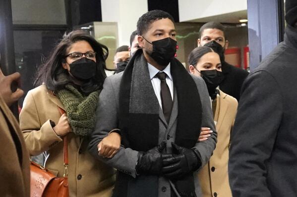 Actor Jussie Smollett, center, leaves the Leighton Criminal Courthouse with unidentified siblings, Thursday, Dec. 9, 2021, in Chicago, following a verdict in his trial. Smollett was convicted Thursday on five of six charges he staged an anti-gay, racist attack on himself nearly three years ago and then lied to Chicago police about it. (AP Photo/Nam Y. Huh)