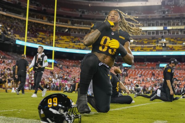 Washington Commanders defensive end Chase Young (99) warming up before the start of an NFL football game against the Chicago Bears, Thursday, Oct. 5, 2023, in Landover, Md. (AP Photo/Andrew Harnik)