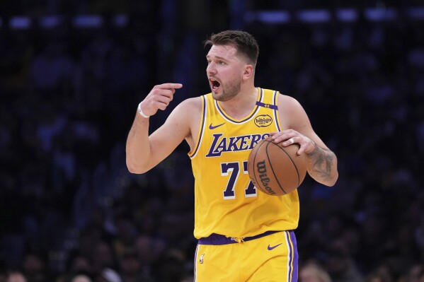 Luka Doncic scores 31 after a big 1st quarter, and the Lakers rout the  depleted Nuggets 120-108 | AP News