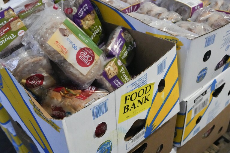 Recovered food is prepared to be distributed at a mobile food bank at Feeding Westchester in Elmsford, N.Y., Wednesday, Nov. 15, 2023. A growing number of states are working to keep food out of landfills over concerns that it is taking up too much space and posing environmental problems. Some states including New York are requiring supermarkets and other businesses to redirect food to food pantries. (AP Photo/Seth Wenig)