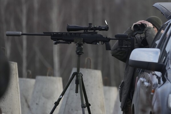 A Polish soldier at Poland's border with Russia, in Dabrowka, Poland, on Saturday Nov. 30, 2024. (AP Photo/Czarek Sokolowski, File)