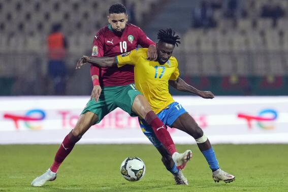 FILE - Gabon's Andre Biyogo Poko, right, is challenged by Morocco's Youssef En-Nesyri, during the African Cup of Nations 2022 group C soccer match between Gabon and Morocco at the Ahmadou Ahidjo stadium in Yaounde, Cameroon, Tuesday, Jan. 18, 2022. (AP Photo/Themba Hadebe, File)