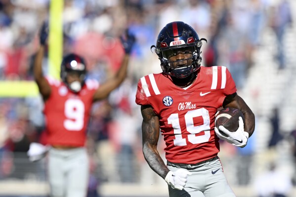 Mississippi wide receiver Dayton Wade (19) runs for a 58-yard touchdown reception during the second half of an NCAA college football game against Louisiana Monroe in Oxford, Miss., Saturday, Nov. 18, 2023. Mississippi won 35-3. (AP Photo/Thomas Graning)