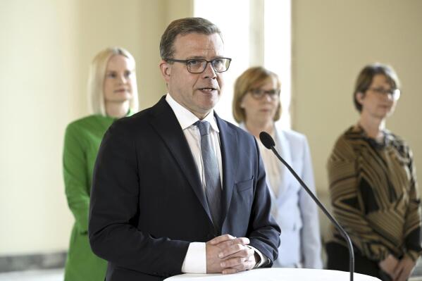 National Coalition chair Petteri Orpo during his press conference at the Parliament House in Helsinki, Finland on Thursday, April 27, 2023. Orpo announced his partners to form the new government to Finland. In background, from left, Finns Party chair Riikka Purra, Swedish Peoples Party chair Anna-Maja Henriksson and Christian Democrats chair Sari Essayah. (Heikki Saukkomaa/Lehtikuva via AP)