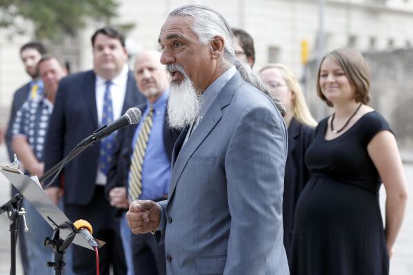 FILE - In this May 1, 2014 file photo, Libertarian party candidate for Texas attorney general Jamie Balagia speaks in front of the Alamo in San Antonio, Texas, about his election platform. Balagia, a Texas lawyer known as the "DWI Dude" has been sentenced to more than 15 years in federal prison for falsely promising Colombian drug traffickers he'd get their charges reduced in exchange for cash.  Balagia was sentenced Monday, May, 3, 2021, to 188 months in federal prison. (William Luther/The San Antonio Express-News via AP)