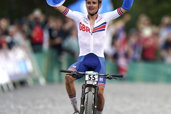 Great Britain's Thomas Pidcock celebrates winning the Men Elite Cross-country Olympic race during day ten of the 2023 UCI Cycling World Championships at Glentress Forest, Scotland, Saturday Aug. 12, 2023. (Tim Goode/PA via AP)