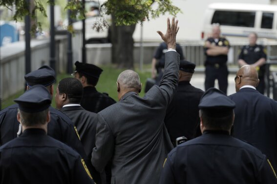 Bill Cosby waves as he leaves the Montgomery County Courthouse after a preliminary hearing on Tuesday, May 24, 2016, in Norristown, Pa. (AP Photo/Matt Slocum)