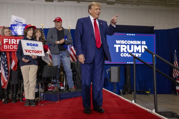 Republican presidential candidate former President Donald Trump takes the stage before speaking Tuesday, April 2, 2024, at a rally in Green Bay, Wis. (AP Photo/Mike Roemer)