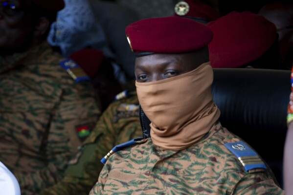 FILE - Burkina Faso coup leader Capt. Ibrahim Traore participates in a ceremony in Ouagadougou, Oct. 15, 2022. Traore, the military leader of Burkina Faso, will remain in office for another five years following the signing of a new charter after national consultations in the capital, Saturday, May 25, 2024. (AP Photo/Kilaye Bationo, File)
