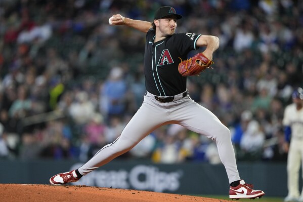 Arizona Diamondbacks starting pitcher Brandon Pfaadt throws against the Seattle Mariners during the first inning of a baseball game Sunday, April 28, 2024, in Seattle. (AP Photo/Lindsey Wasson)