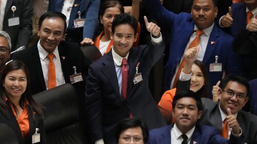 Pita Limjaroenrat, center, the leader of Move Forward Party and top winner in the May's general election, gestures after the vote counting at the Parliament in Bangkok, Thailand, Thursday, July 13, 2023. Pita, whose Move Forward Party ran first in Thailand's May 14 general election, was nominated to be prime minister at a joint session of Parliament's Upper and Lower House on Thursday, but failed to attain the majority vote needed to win the job, necessitating a new round of voting expected next week. (AP Photo/Sakchai Lalit)