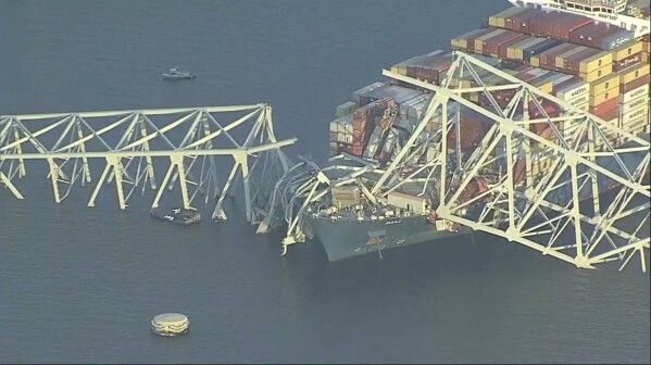 Parts of the Francis Scott Key Bridge remain after a container ship collided with a support Tuesday, March 26, 2024 in Baltimore. (WJLA via AP)