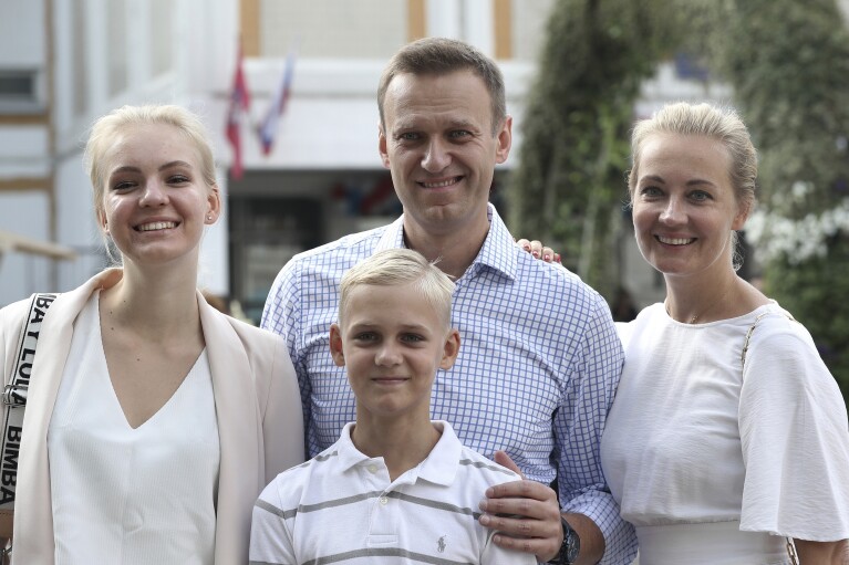FILE - Russian opposition leader Alexei Navalny, with his wife Yulia, right, daughter Daria, and son Zakhar pose for the media after voting during a city council election in Moscow, Russia, on Sept. 8, 2019. Alexei Navalny, the fiercest foe of Russian President Vladimir Putin who crusaded against official corruption and staged massive anti-Kremlin protests, died in prison Friday Feb. 16, 2024 Russia’s prison agency said. He was 47. (AP Photo/Andrew Lubimov, File)