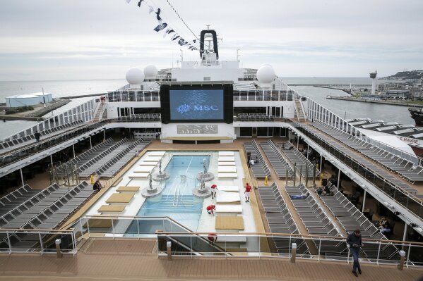 FILE - This June 3, 2017 file photo shows the upper deck pool area of the MSC Meraviglia cruise ship docked in Le Havre harbour, Normandy, France. The cruise ship was turned away in Feb. 2020 by two nations, Grand Cayman and Jamaica, after it reported one crew member from the Philippines was sick with common seasonal flu, and is being allowed to dock at Mexico’s Caribbean island of Cozumel and passengers will be allowed to disembark, President Andrés Manuel López Obrador said Thursday, Feb. 27, 2020. (AP Photo/Thomas Padilla, File)