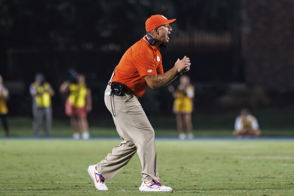 CORRECTS TO MONDAY, SEPT. 4, 2023, NOT TUESDAY, SEPT. 5, 2023 - Clemson head coach Dabo Swinney shouts to his team during the second half of an NCAA college football game against Duke in Durham, N.C., Monday, Sept. 4, 2023. (AP Photo/Ben McKeown)