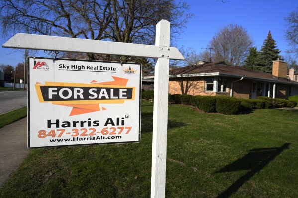 A "For Sale" sign is displayed in front of a home in Skokie, Ill., Sunday, April 14, 2024. On Thursday, May 2, 2024, Freddie Mac reports on this week's average U.S. mortgage rates. (AP Photo/Nam Y. Huh)