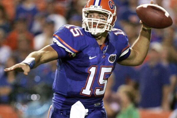 FILE - Florida quarterback Tim Tebow throws a pass during the first half of an NCAA college football game against LSU in Gainesville, Fla., Oct. 11, 2008. Tebow, who led Florida to two national championships and won a Heisman Trophy, is among the former players making their first appearance on the College Football Hall of Fame ballot this year. The National Football Foundation announced on Monday, June 6, 2022, the players and coaches eligible for election into the Hall of Fame, and 11 of the 80 FBS players will be debuting on the ballot. (AP Photo/John Raoux, File)