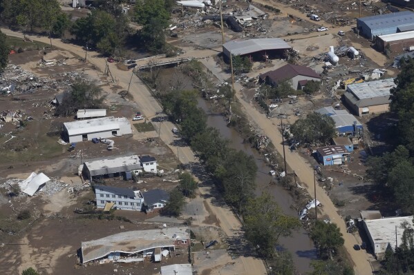 FILE - Damage from Hurricane Helene near Asheville, N.C., is seen during an aerial tour for President Joe Biden, Oct. 2, 2024. (AP Photo/Susan Walsh, File)