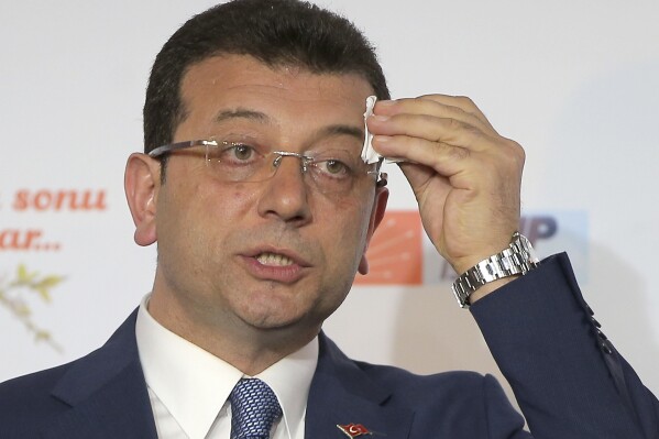 FILE -Ekrem Imamoglu, mayoral candidate for Istanbul of Republican People's Party (CHP) wipes sweat off his forehead during a press conference after the local elections, in Istanbul, March 31, 2019. (AP Photo/File)