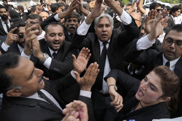 Lawyers chant slogans during a rally against the recent increase in electricity and fuel prices and demanding the announcement of parliamentary election, in Lahore, Pakistan, Thursday, Sept. 21, 2023. Pakistan's election oversight body announced on Thursday that it will hold the next parliamentary elections in the last week of January, delaying the vote which was to be held in November under the constitution. (AP Photo/K.M. Chaudary)
