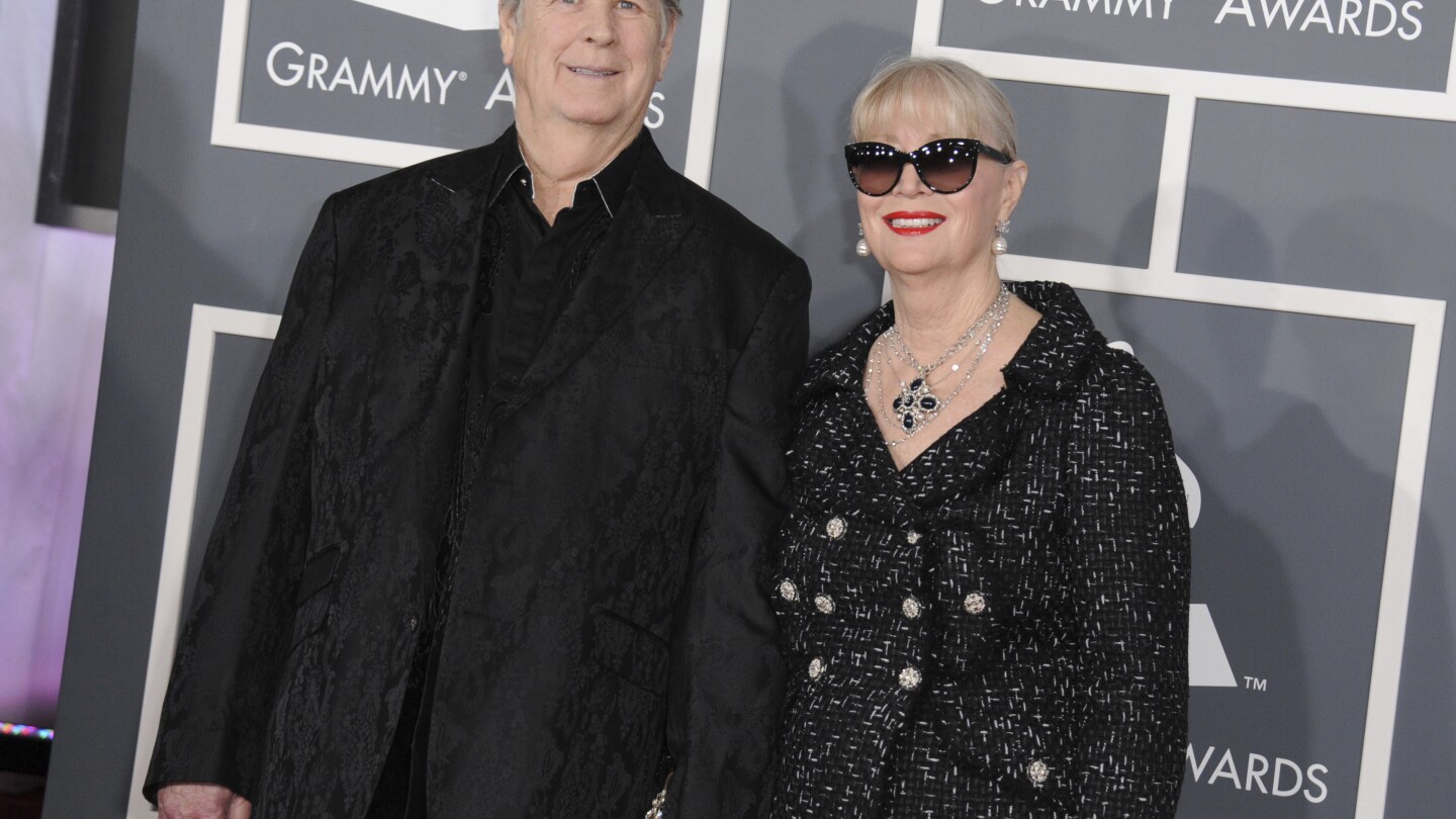 FILE - Musician Brian Wilson, left, and his wife Melinda Ledbetter Wilson arrive at the 55th annual Grammy Awards on Sunday, Feb. 10, 2013, in Los Angeles. The management team of the Beach Boys co-founder has filed papers to put him in a conservatorship. The court filing says Wilson needs someone to oversee his daily life and medical decisions because of the recent death of his wife. (Photo by Jordan Strauss/Invision/AP, File)