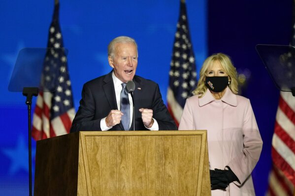 Democratic presidential candidate former Vice President Joe Biden speaks to supporters Wednesday, Nov. 4, 2020, in Wilmington, Del., as he stands next to his wife Jill Biden. (AP Photo/Andrew Harnik)