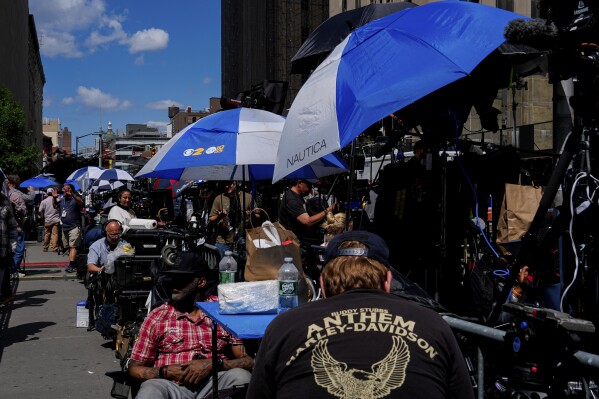 Members of the media work outside Manhattan Criminal Court, Thursday, May 30, 2024, in New York. (AP Photo/Julia Nikhinson)