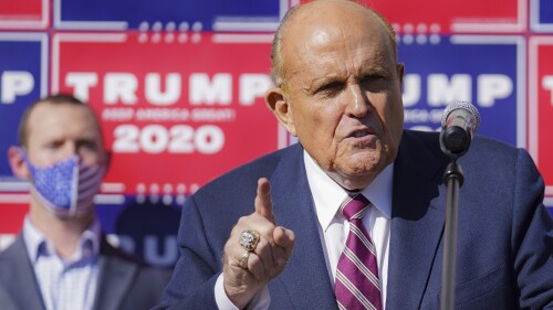 FILE - Former New York mayor Rudy Giuliani, a lawyer for President Donald Trump, speaks during a news conference at Four Seasons Total Landscaping on legal challenges to vote counting in Pennsylvania, Nov. 7, 2020, in Philadelphia. A review panel says Giuliani should be disbarred in Washington for how he handled litigation challenging the 2020 election on behalf of then-President Donald Trump. The panel's report was released Friday, July 7, 2023. (AP Photo/John Minchillo, File)