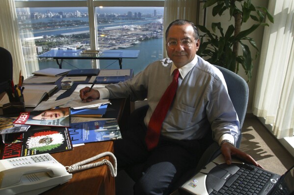 Manuel Rocha sits in his office at Steel Hector & Davis in Miami in January 2003, joining the firm to help open doors in Latin America. Long before Rocha, a former U.S. diplomat, was arrested in 2023 on charges of being a secret agent of Cuba for decades, there were plenty of red flags. An Associated Press investigation found the CIA received a tip about his alleged double life as far back as 2006, that Rocha may have been on a short list of suspected spies since 2010 and could have been linked to intelligence from 1987 of a U.S. turncoat known as Fidel Castro鈥檚 鈥渟uper mole.鈥� (Raul Rubiera/Miami Herald via AP)