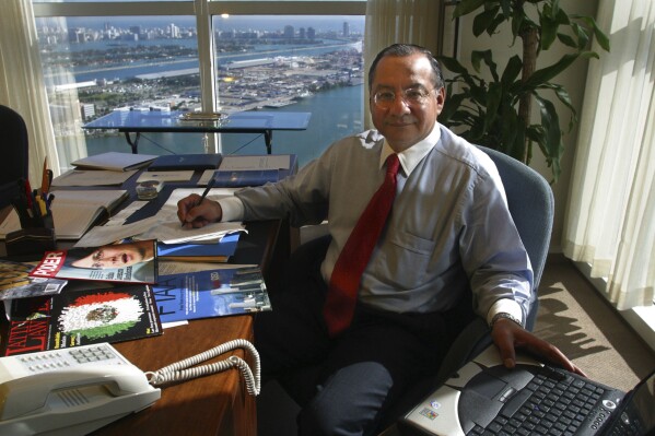 Manuel Rocha sits in his office at Steel Hector & Davis in Miami in January 2003, joining the firm to help open doors in Latin America. Long before Rocha, a former U.S. diplomat, was arrested in 2023 on charges of being a secret agent of Cuba for decades, there were plenty of red flags. An Associated Press investigation found the CIA received a tip about his alleged double life as far back as 2006, that Rocha may have been on a short list of suspected spies since 2010 and could have been linked to intelligence from 1987 of a U.S. turncoat known as Fidel Castro’s “super mole.” (Raul Rubiera/Miami Herald via AP)