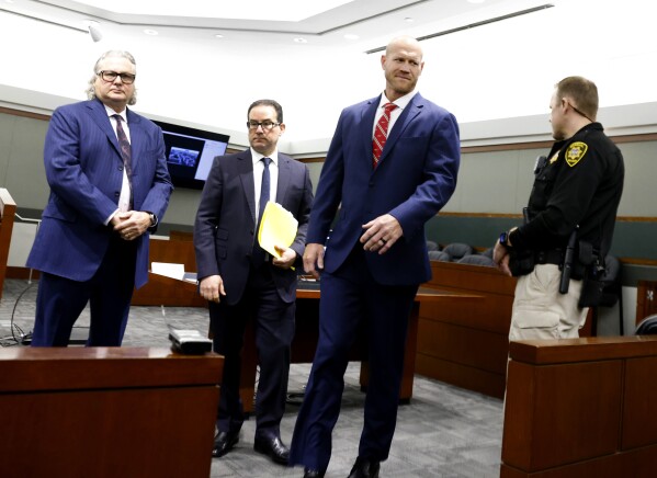 Daniel Rodimer, second right, leaves court with his attorneys David Chesnoff, left, and Richard Schonfeld after his arraignment at the Regional Justice Center in Las Vegas, Wednesday, May 8, 2024. Rodimer, a retired professional wrestler and former congressional candidate in Nevada and Texas has pleaded not guilty to a murder charge in the death of a man last year at a Las Vegas Strip hotel. (Bizuayehu Tesfaye/Las Vegas Review-Journal via AP)