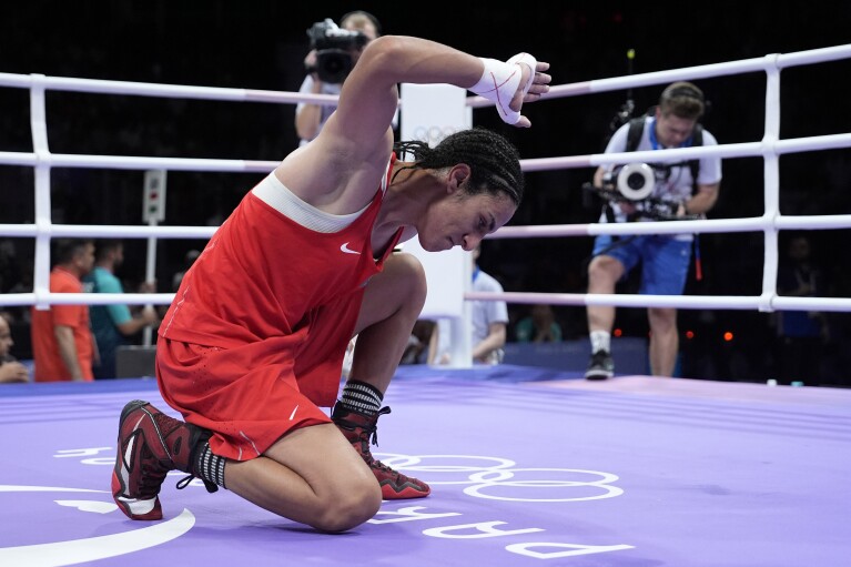 Algerian boxer Imane Khelif clinches Olympic medal after gender outcry | AP  News