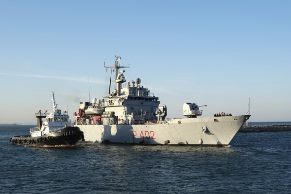 The Italian navy ship Libra arrives at the port of Shengjin northwestern Albania Wednesday, Oct. 16, 2024, carrying the first group of migrants who were intercepted in international waters and redirected to Albania in force of an agreement between the two counties. (AP Photo/Vlasov Sulaj)