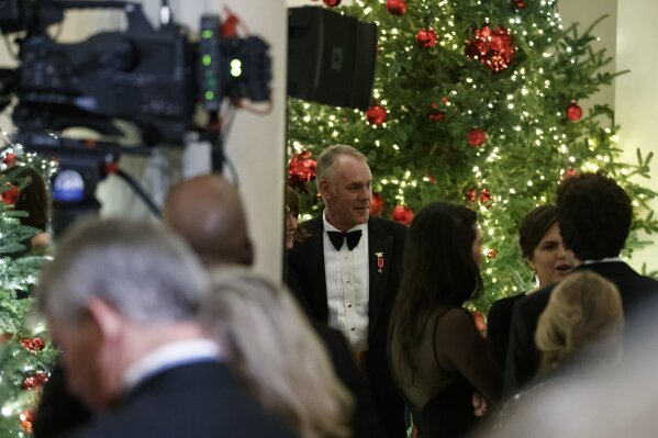 
              Secretary of the Interior Ryan Zinke attends the Congressional Ball in the Grand Foyer of the White House in Washington, Saturday, Dec. 15, 2018. (AP Photo/Carolyn Kaster)
            