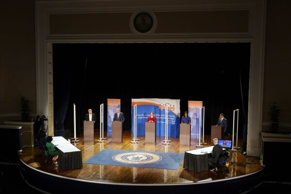 Democratic candidates for governor of Virginia, Del. Lee Carter, left, former Gov. Terry McAuliffe, second from left, state Sen. Jennifer McClellan, center, Del. Jennifer Carroll Foy, second from right, and Virginia Lt. Gov. Justin Fairfax, right, participate in a debate at Virginia State University in Petersburg, Va., Tuesday, April 6, 2021. (AP Photo/Steve Helber)