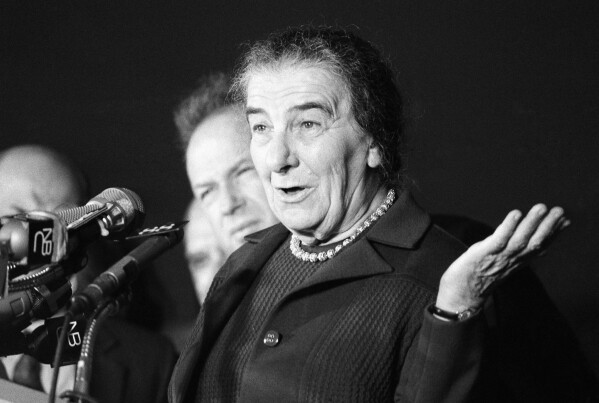 Israeli Premier Golda Meir gestures to newsmen September 16, 1970 at New York's Kennedy Airport on her arrival from Tel Aviv. She flew to the U.S. aboard an El Al Jetliner for talks with president Nixon, Secretary of State William P. Rogers and other top U.S. officials on the middle east situation.(AP Photo/Ron Frehm)