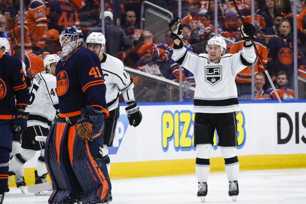 Los Angeles Kings defenseman Troy Stecher, right, celebrates as Edmonton Oilers goalie Mike Smith skates to the bench during overtime in Game 5 of an NHL hockey Stanley Cup first-round playoff series, Tuesday, May 10, 2022 in Edmonton, Alberta. (Jeff McIntosh/The Canadian Press via AP)